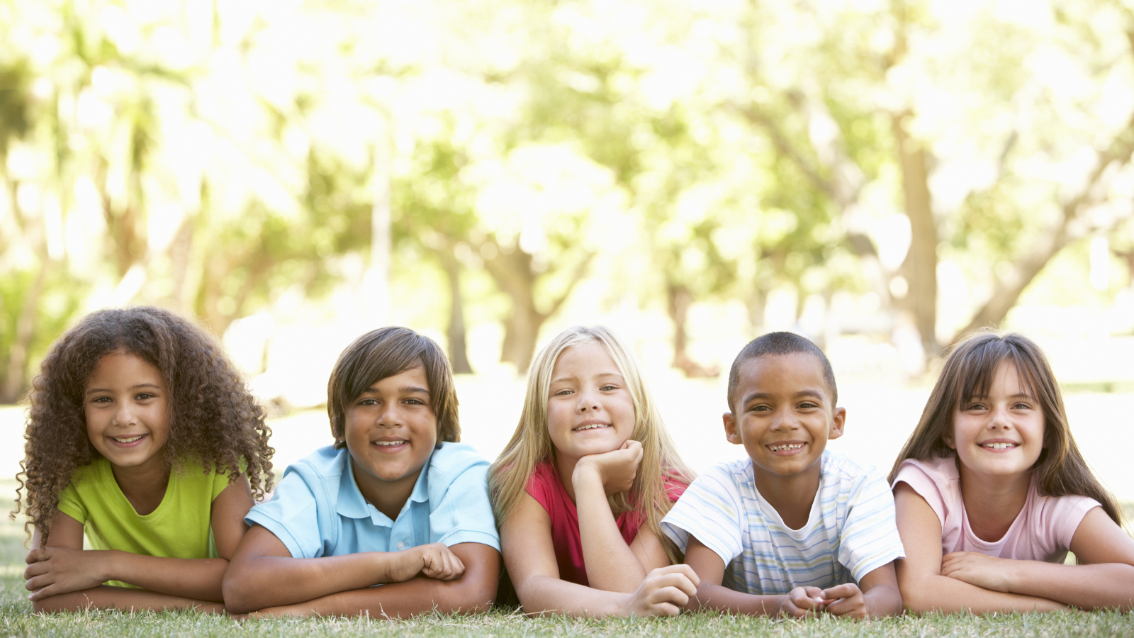 A group of children lying in a park