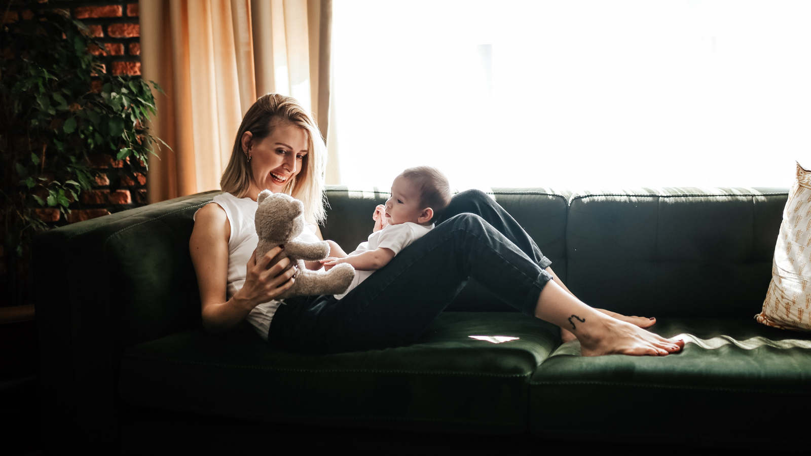 Mother with baby and teddy bear